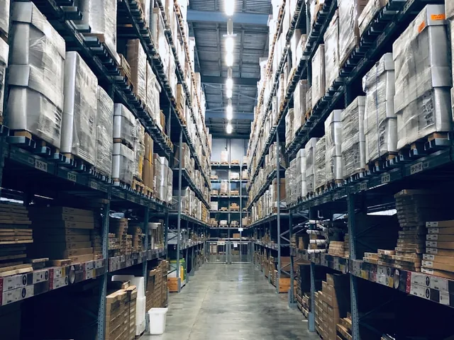 Warehouse aisle with stocked shelves for distribution and wholesale