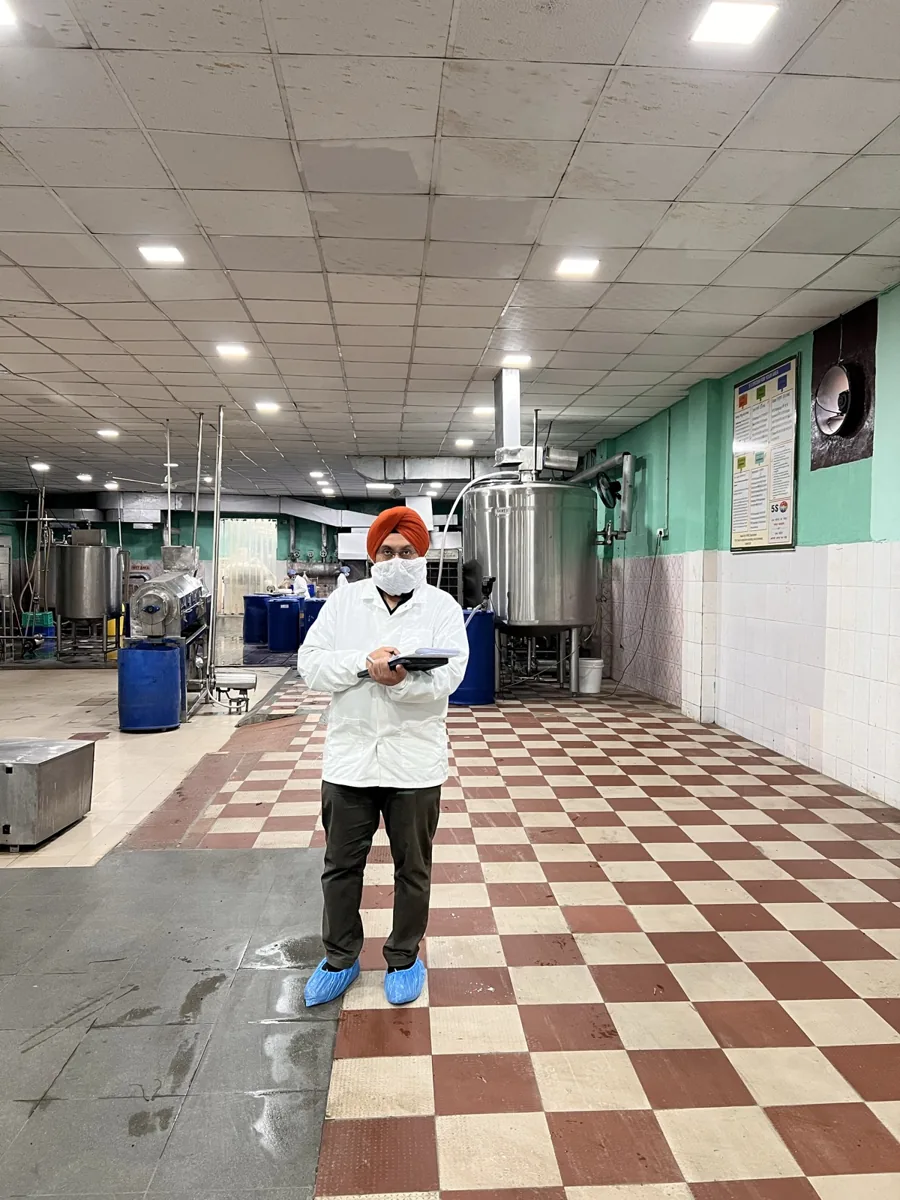 Digiwah consultant mapping production processes on the shop floor of a client's food-processing plant during an on-site Zoho ERP implementation